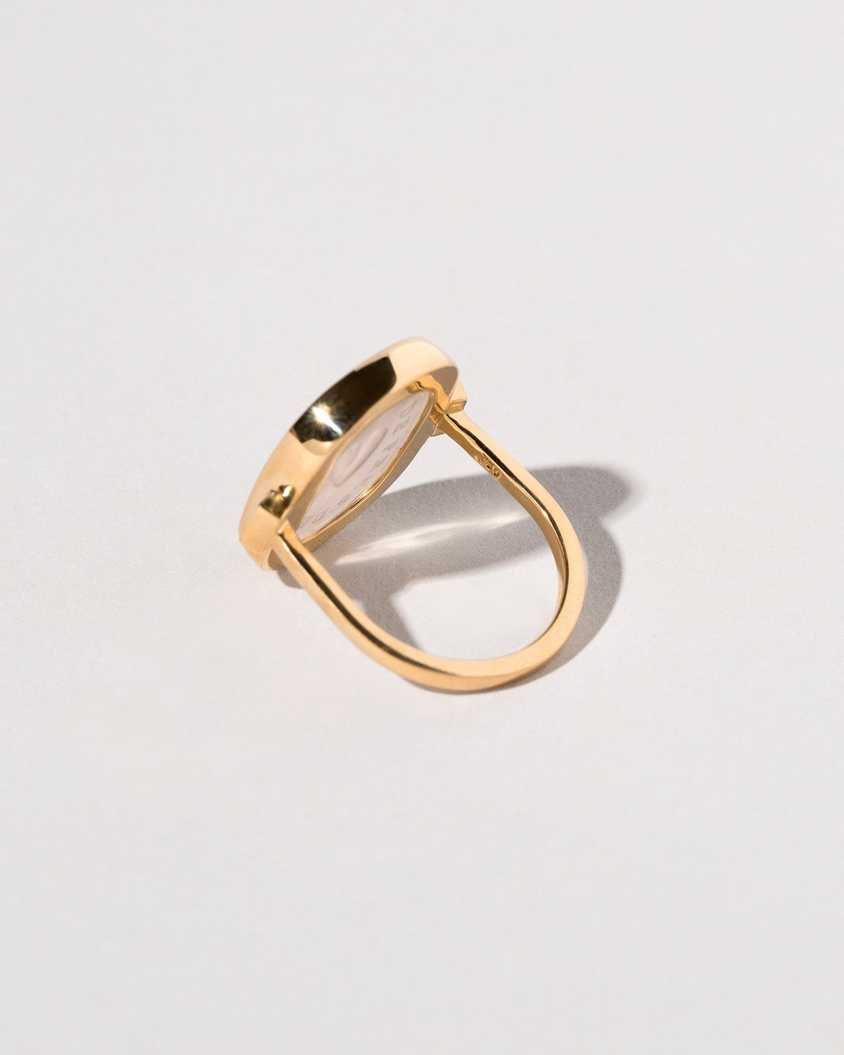 View from the back of the Long Distance Intaglio Seal Ring on light color background.