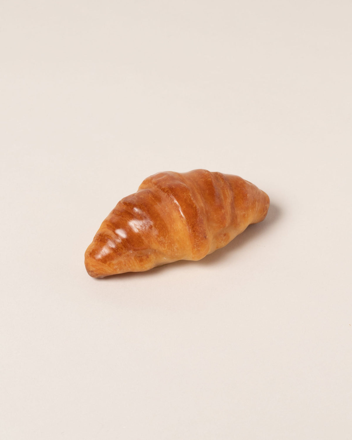 Pampshade Croissant Lamp on light color background.