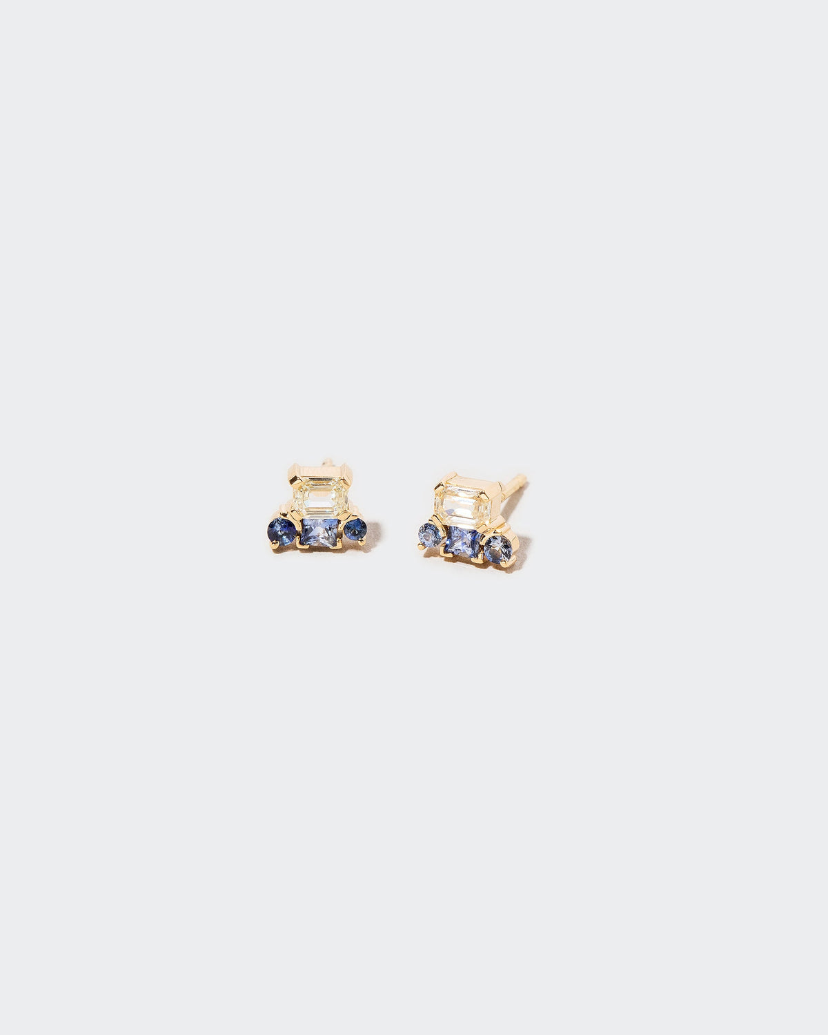 Linear Stud Earrings on light color background.