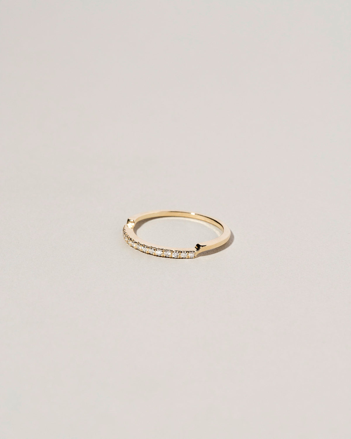 View from the side of the Gold Notched Band on light color background.
