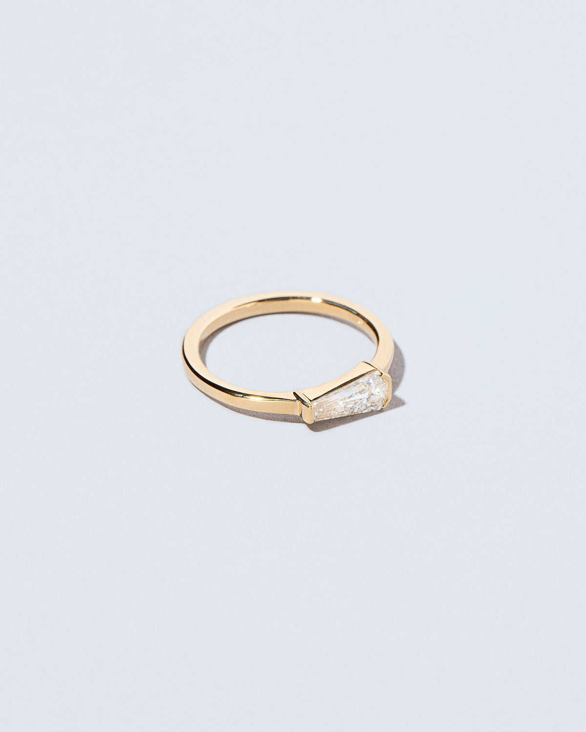 View from the side of the Niphredil Ring on light color background.