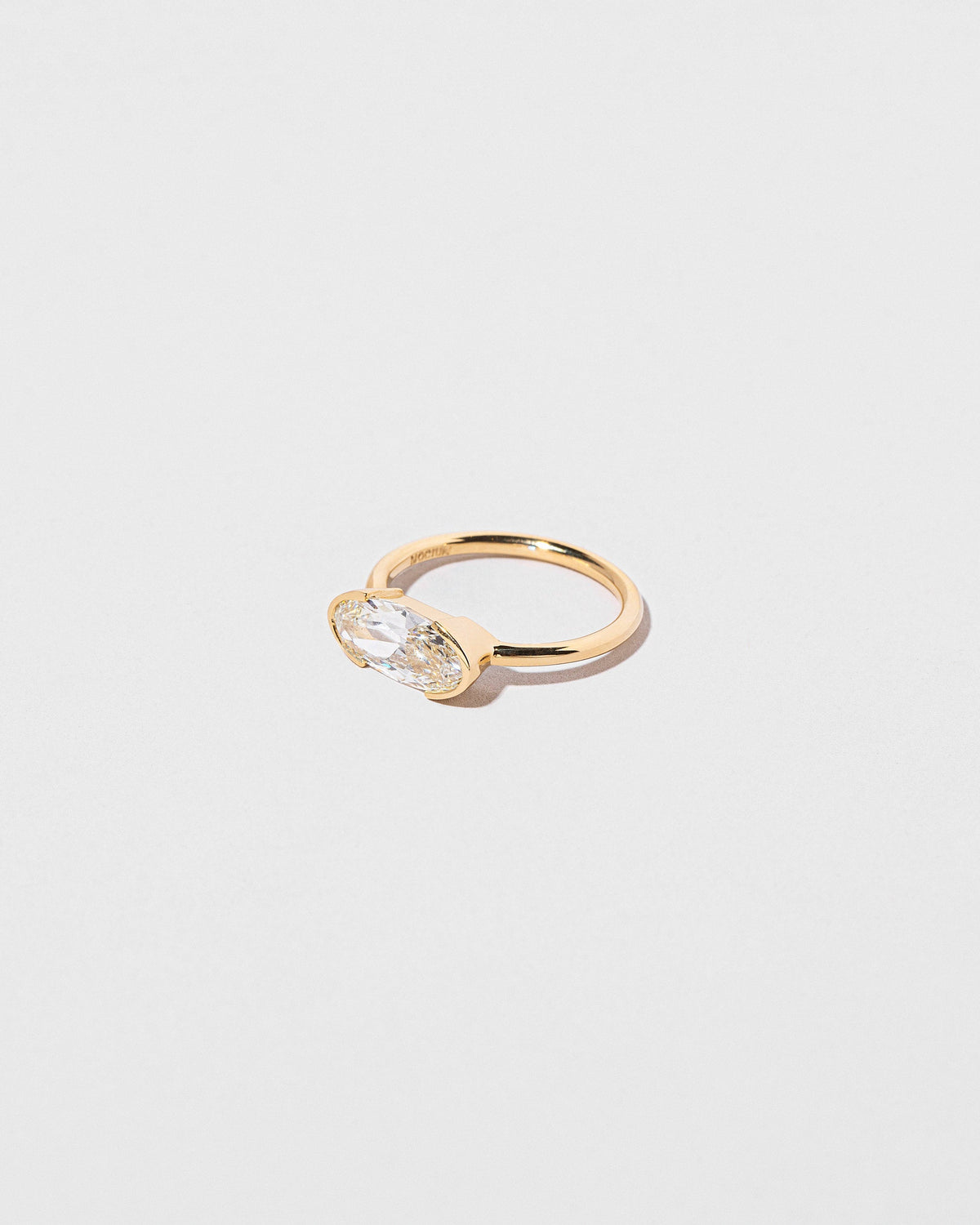 View from the side of the Eternal Ring on light color background.