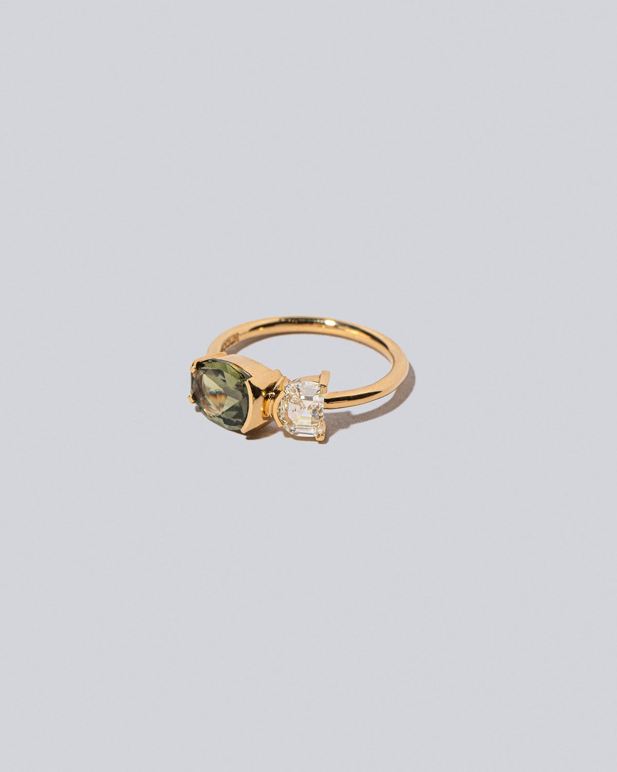 Product photo of Finch Ring on a light color background 