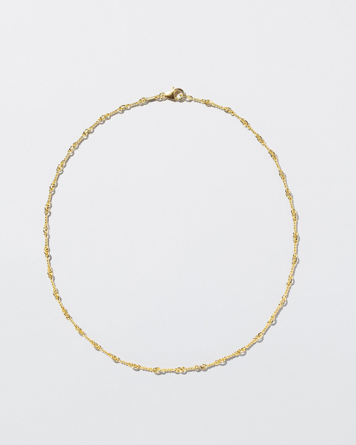  Twisted Chain Necklace on light color background.