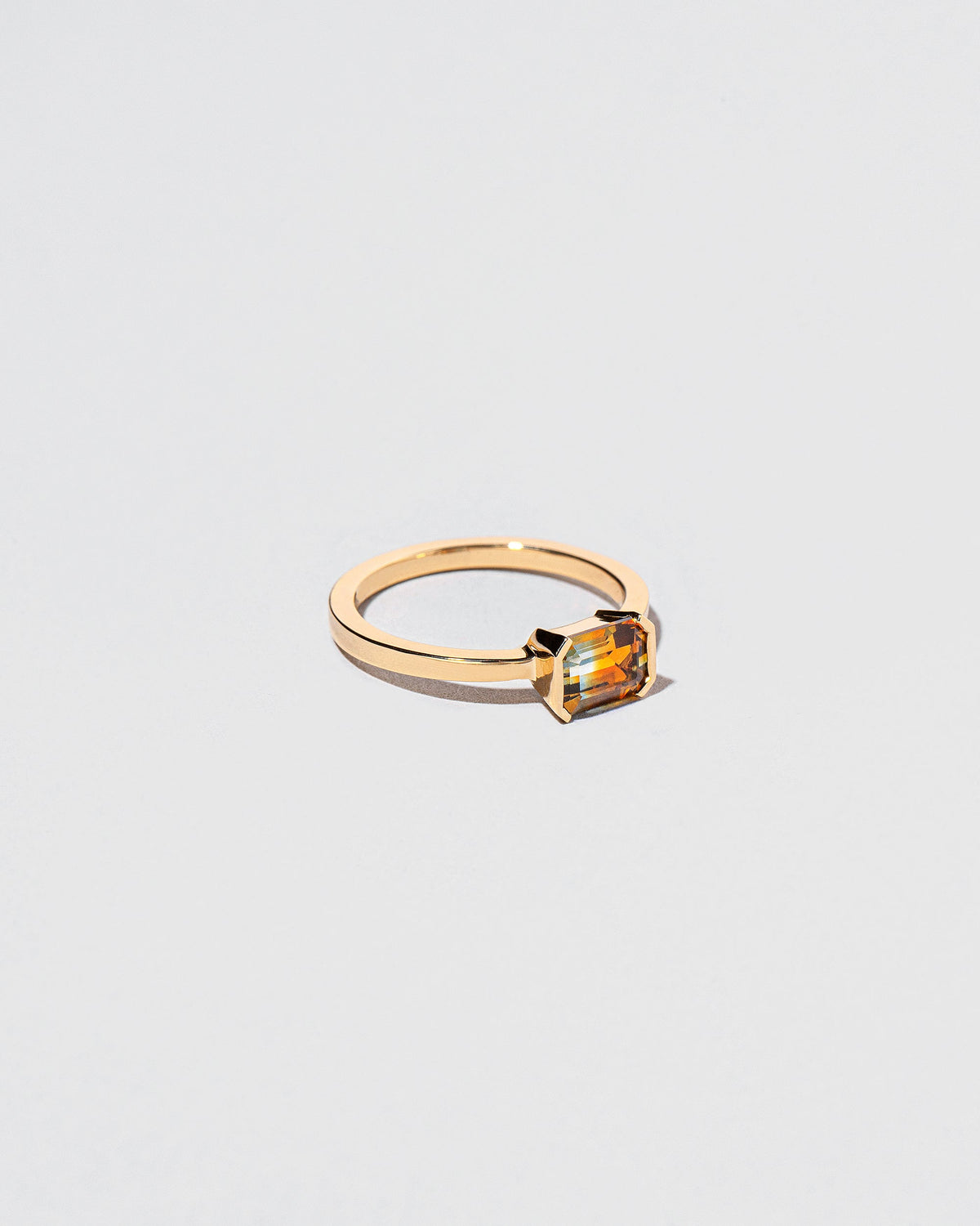 View from the side of the Elowan Ring on light color background.