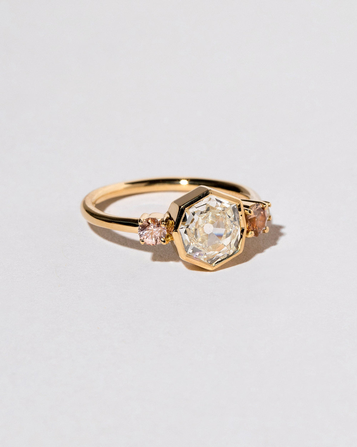  Theia Ring on light color background.