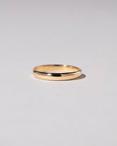 Gold 2mm Half Round Band on light color background.