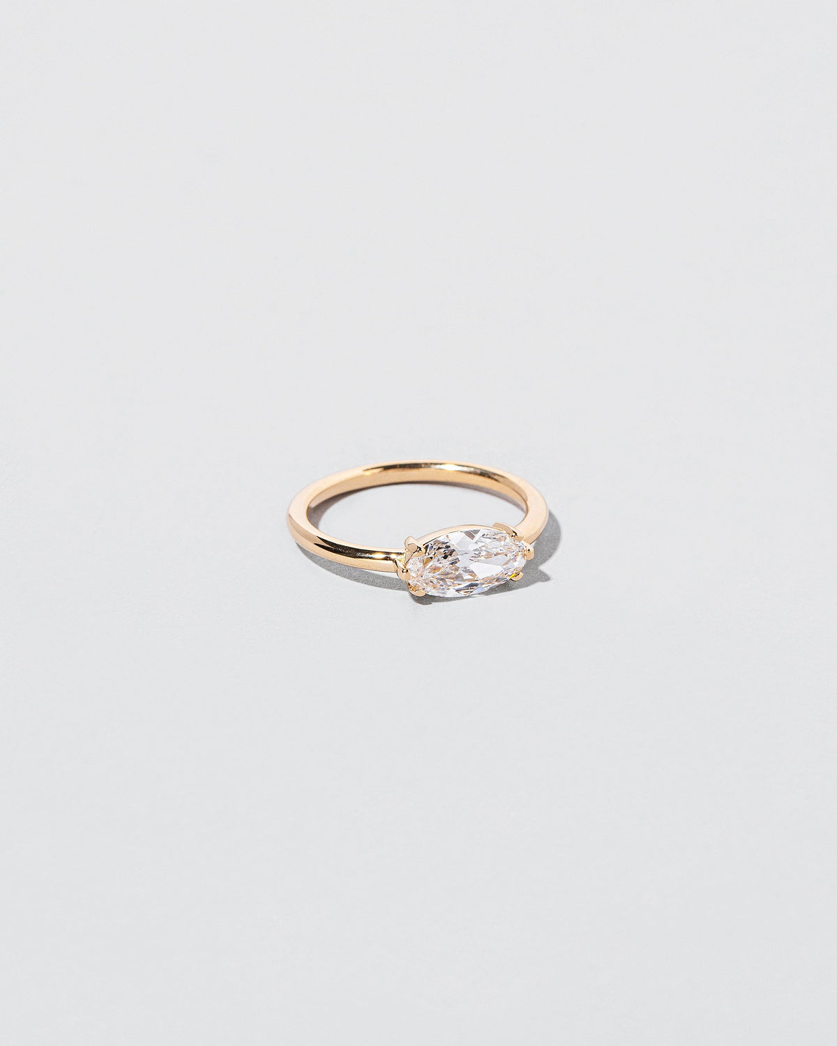  Elixer Ring on light color background.