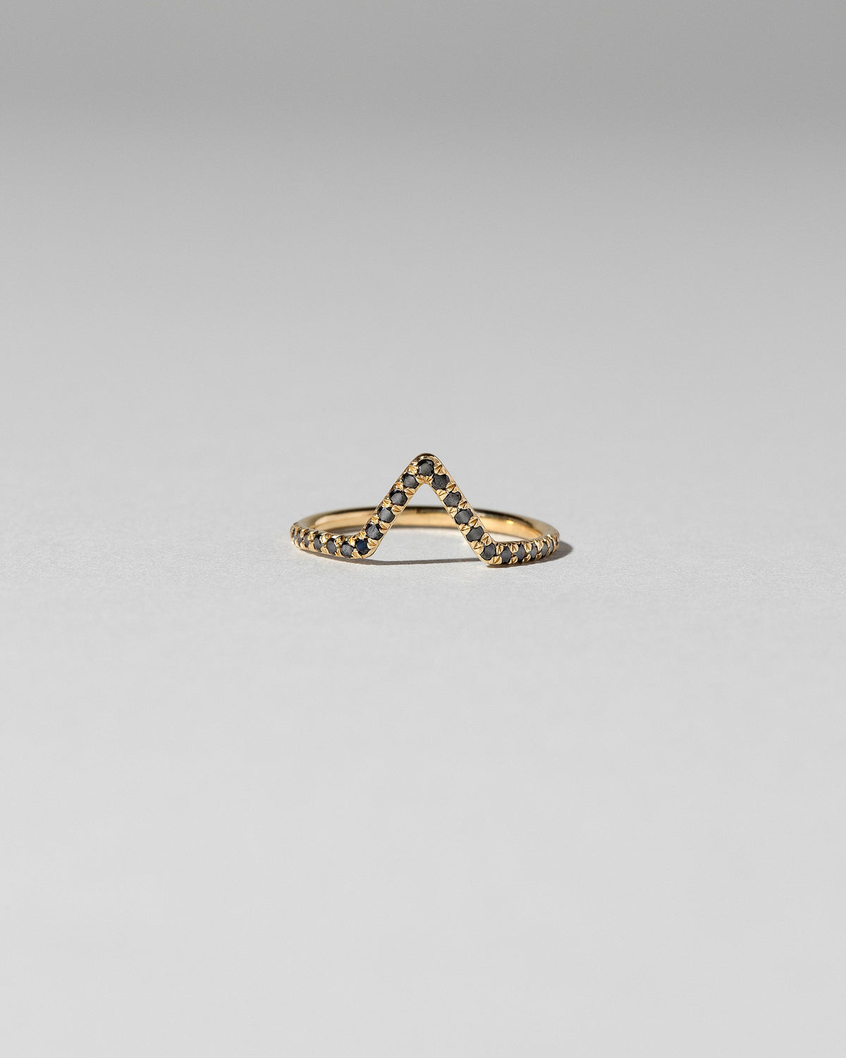 Black Diamond Pavé Triangle Band on light color background.