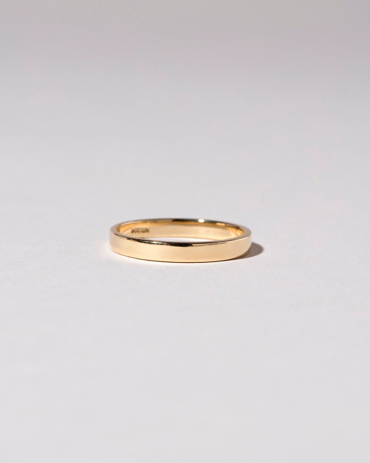 Gold 3mm Square Wire Band on light color background.