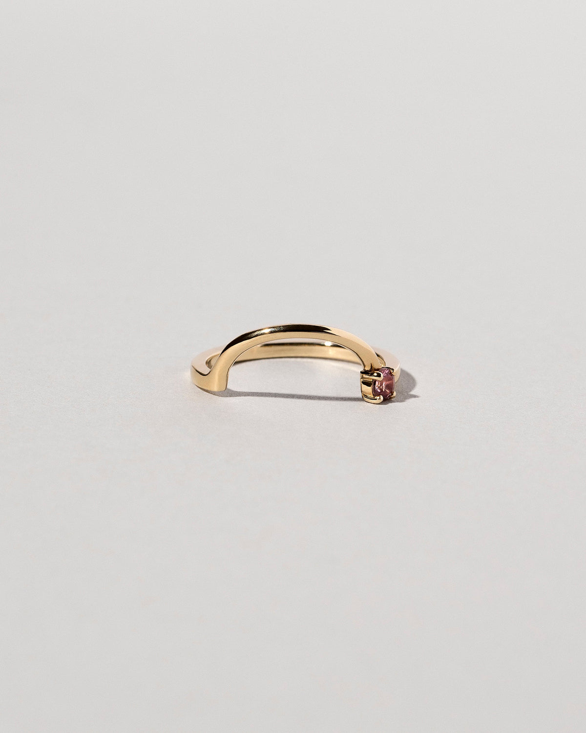 Yellow Gold Spinel Half Hoop Band on light color background.