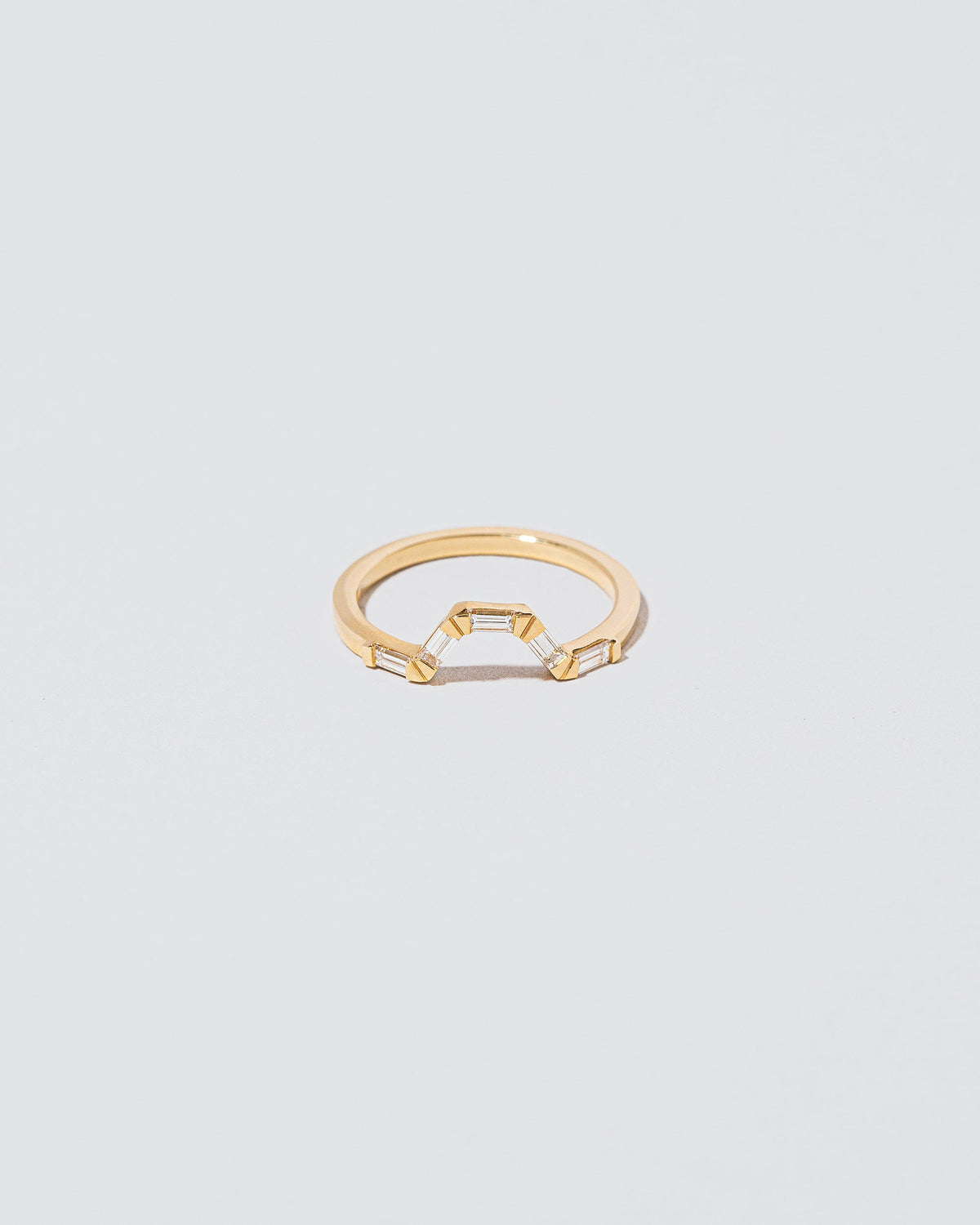 White Diamond Baguette Bridge Band on light color background.