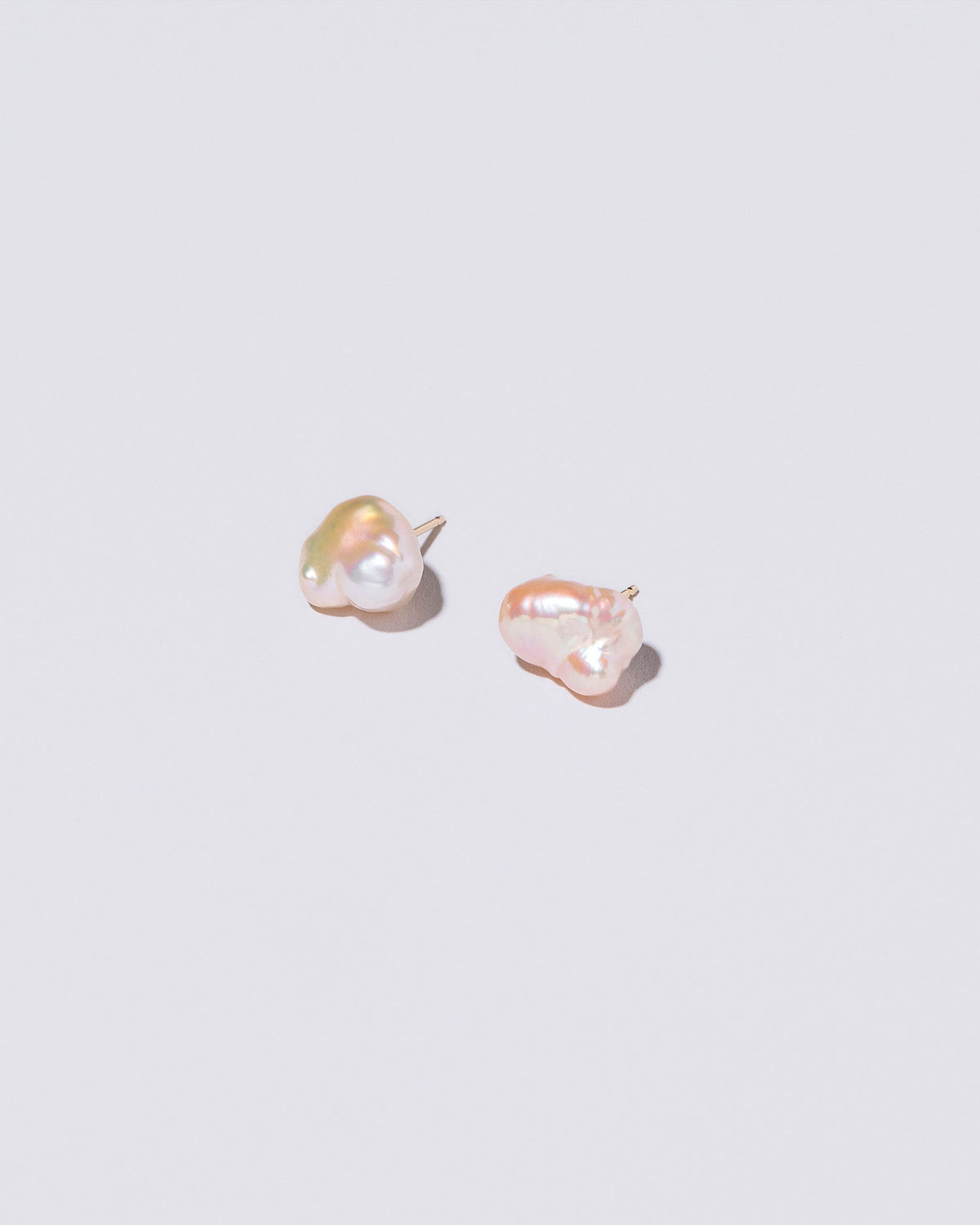  Lagniappe Pearl Stud Earrings on light color background.