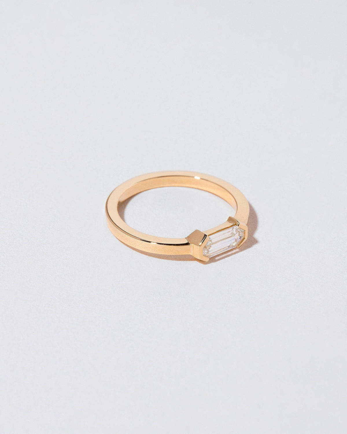 View from the side of the Alcon Ring on light color background.
