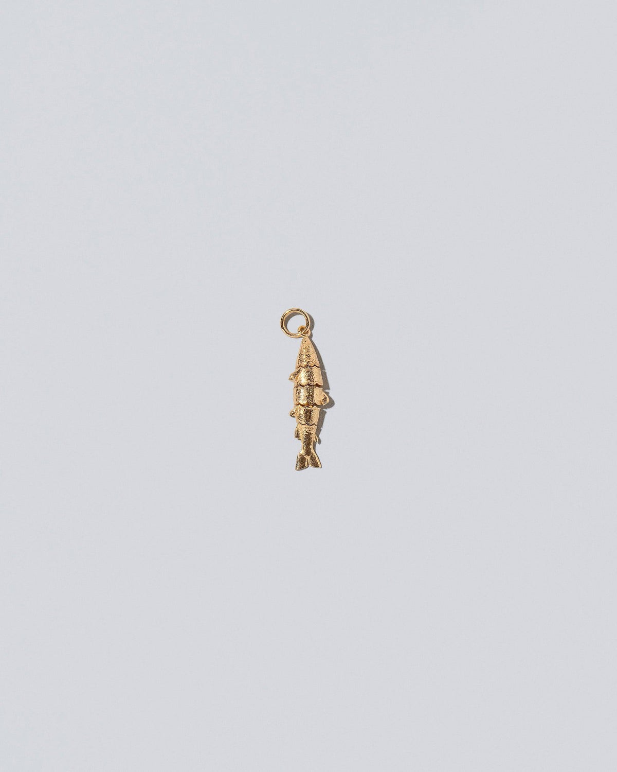 Fish Charm on light color background.
