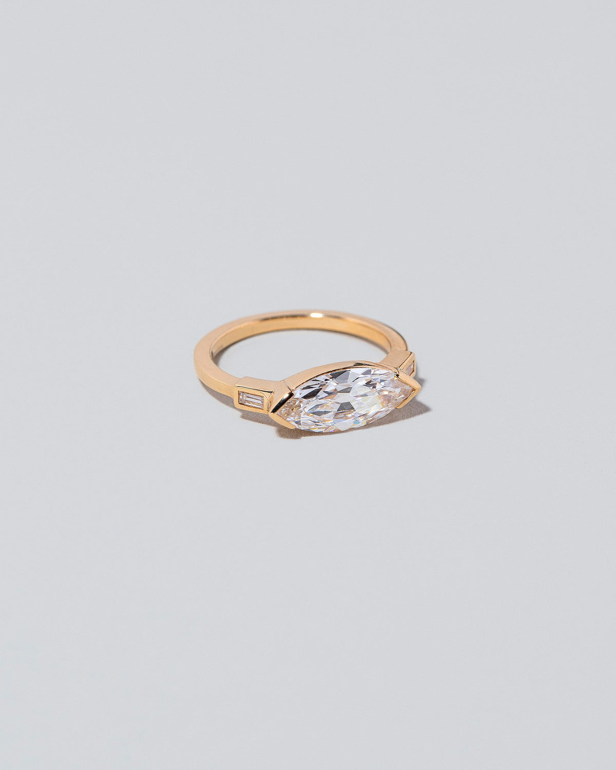 View from the side of the Fins Ring on light color background.