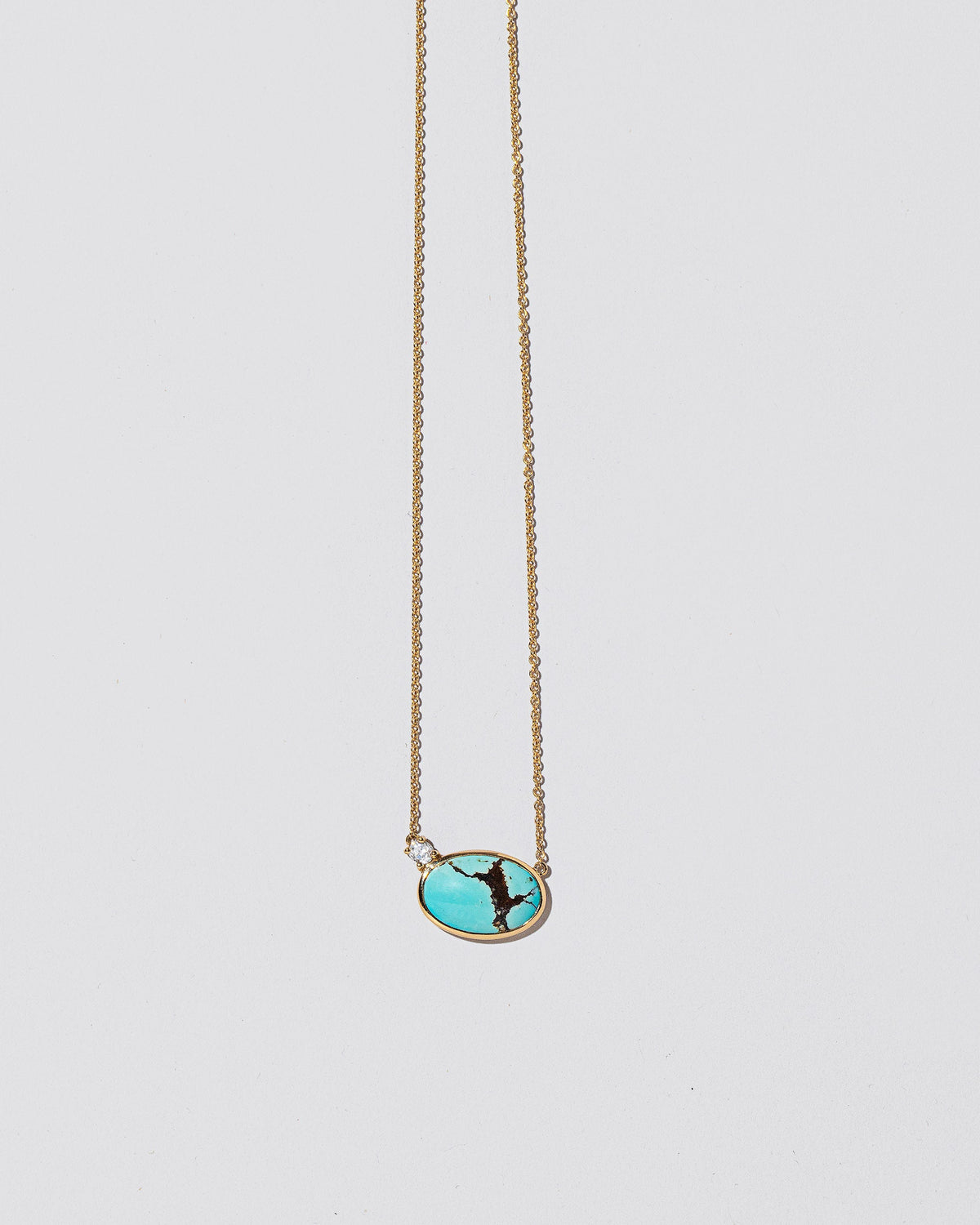 In-Between Necklace on light color background.