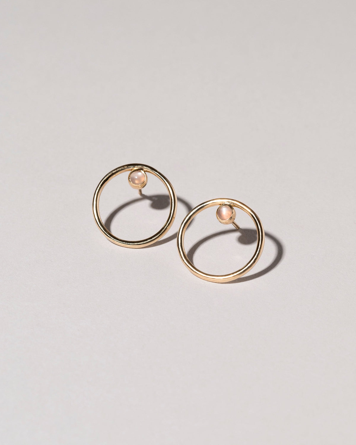  Coil Stud Earrings on light color background.