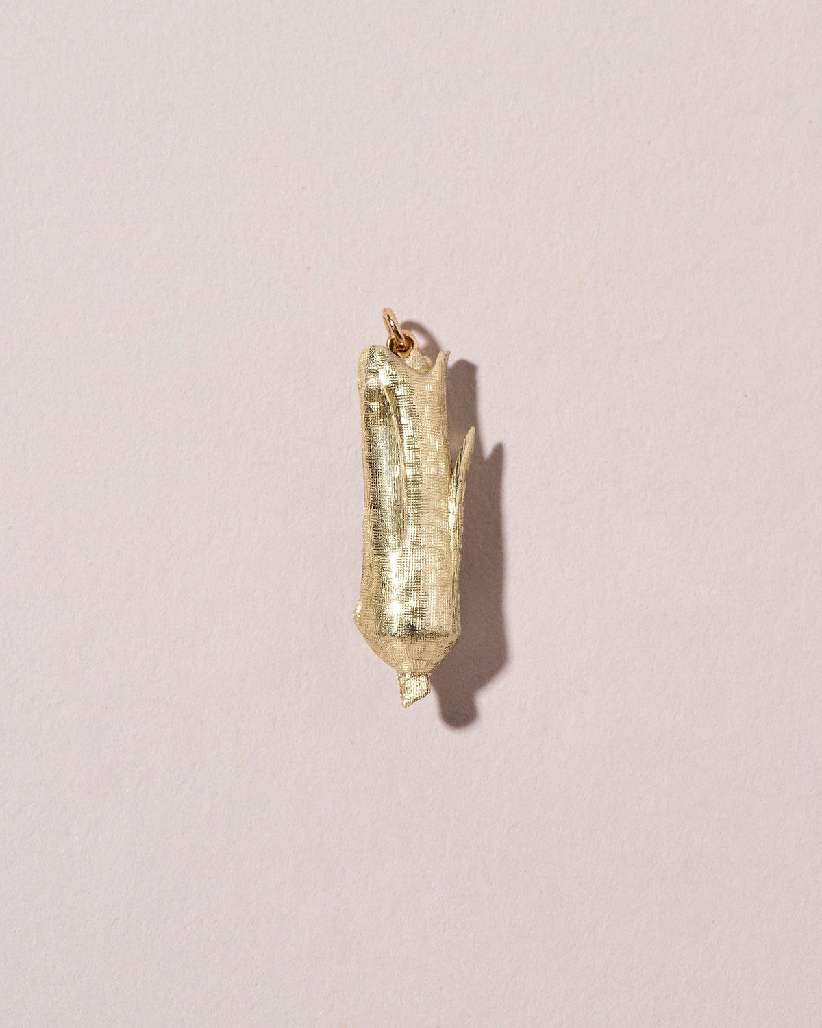  Corn on the Cob Charm on light color background.