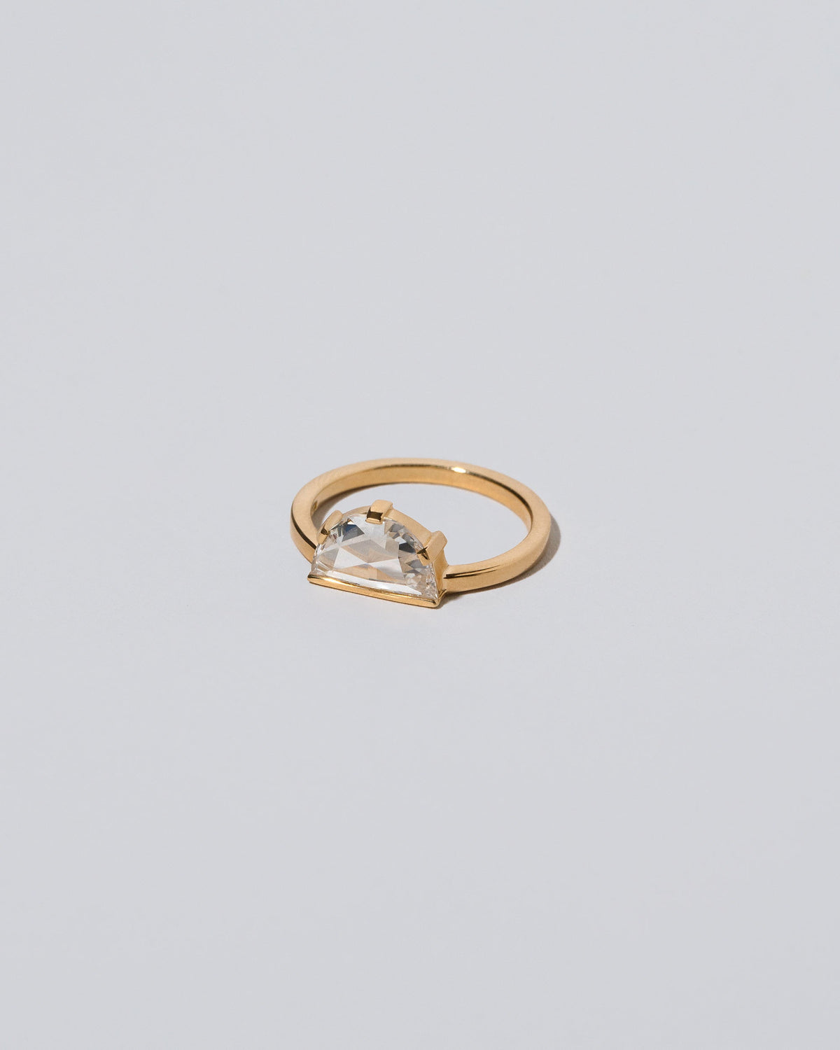 View from the side of the Plié Ring on light color background.