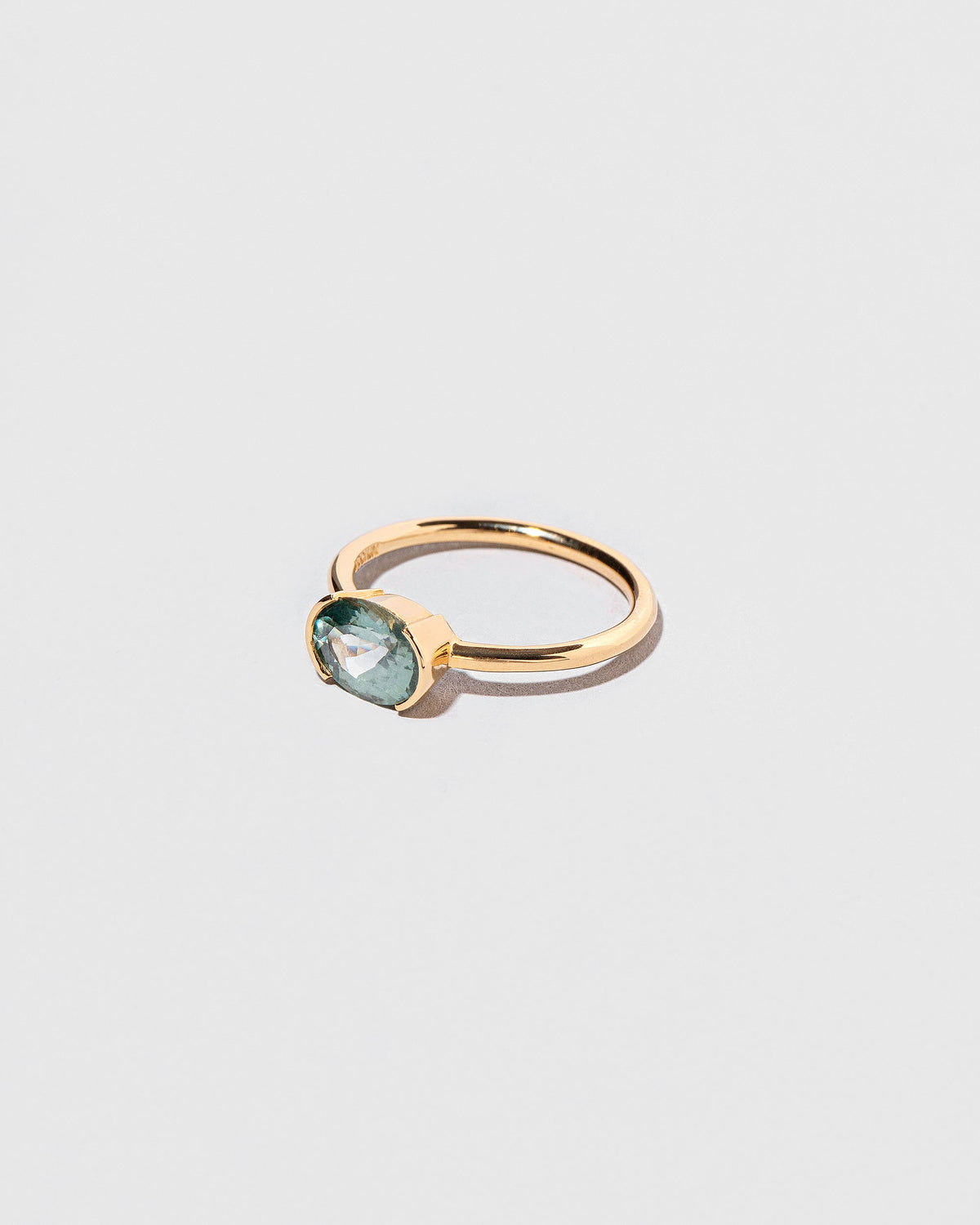 View from the side of the Athelas Ring on light color background.