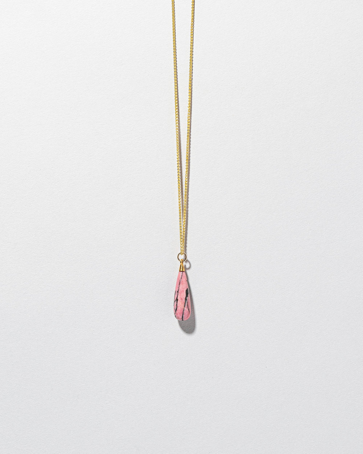  Rhodolite Drop Pendant on light color background.