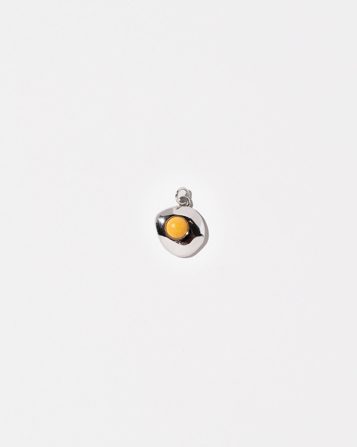 Sunny Side Up Egg Charm Seven on light colored background.
