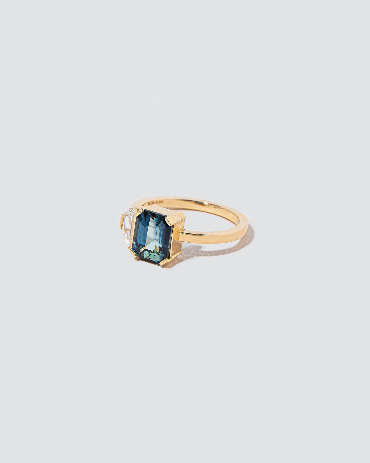  Awakening Ring on light color background.