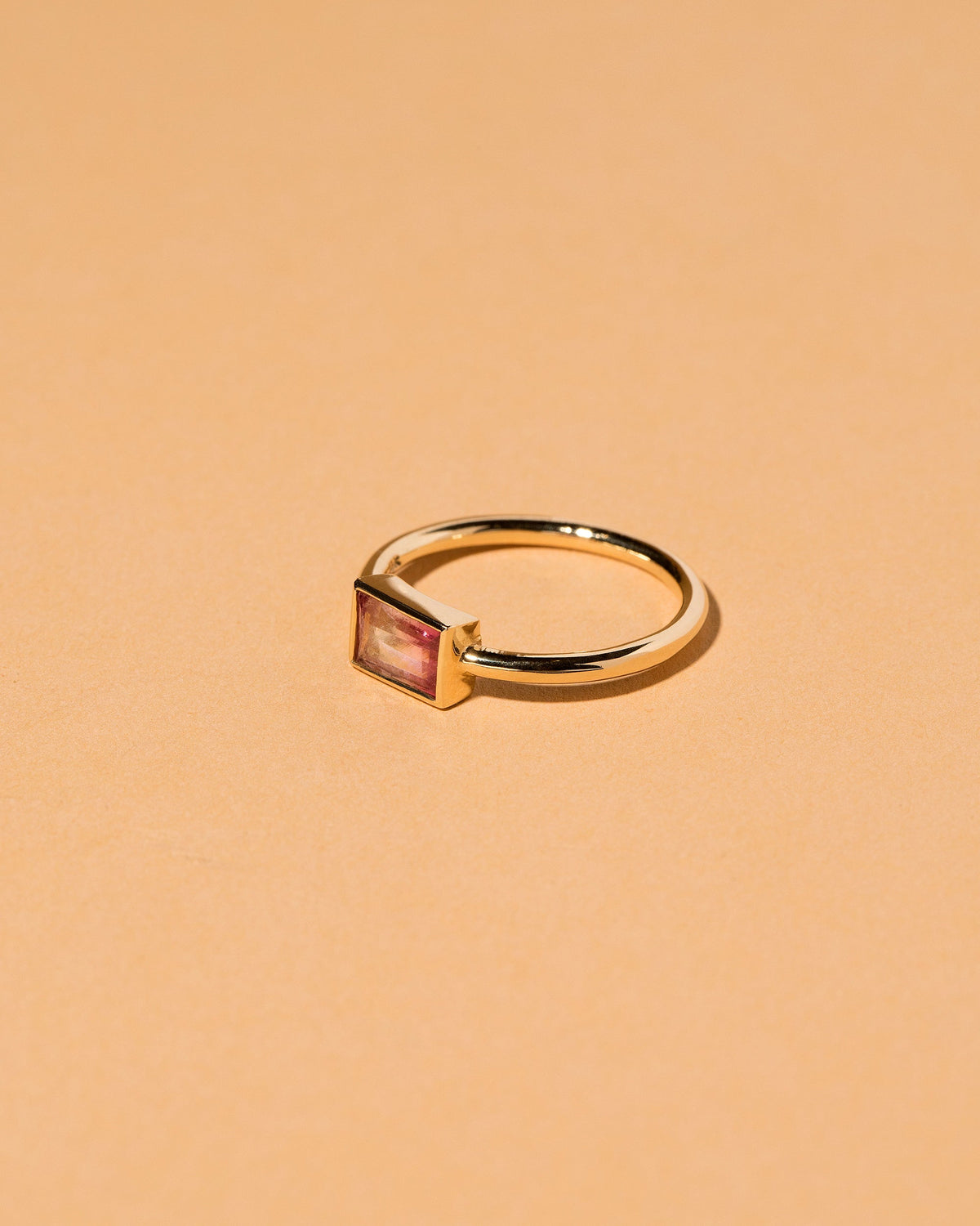 View from the side of the Pink & White Tourmaline Ring on light color background.