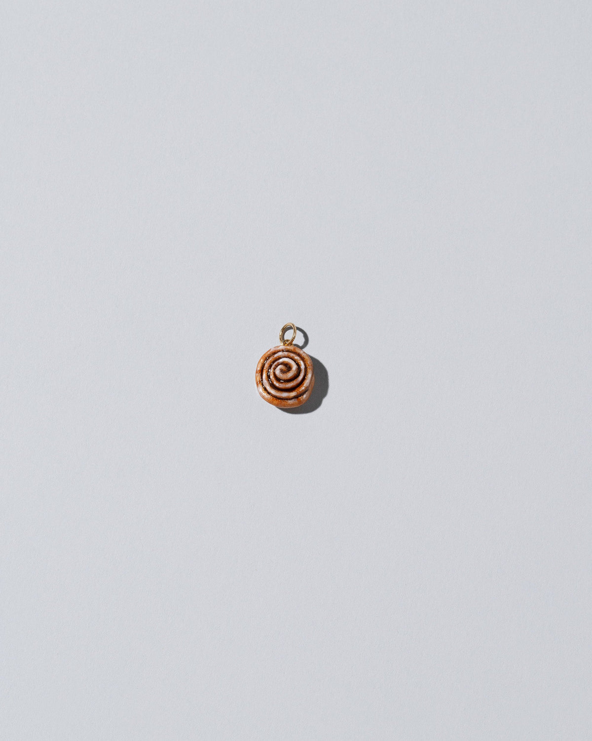 Cinnamon Roll Charm - Enamel  on light colored background