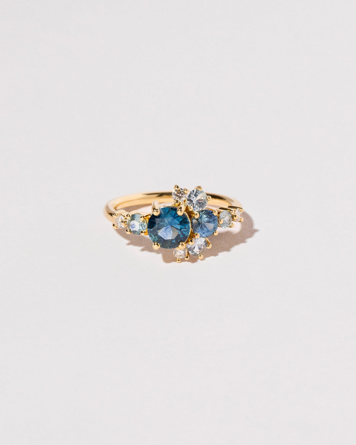  Montana Sapphire Crescent Ring on light color background.