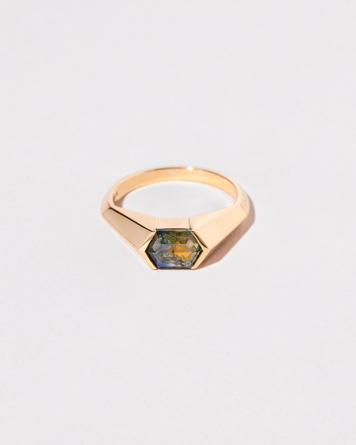 Caelum Ring on light color background.