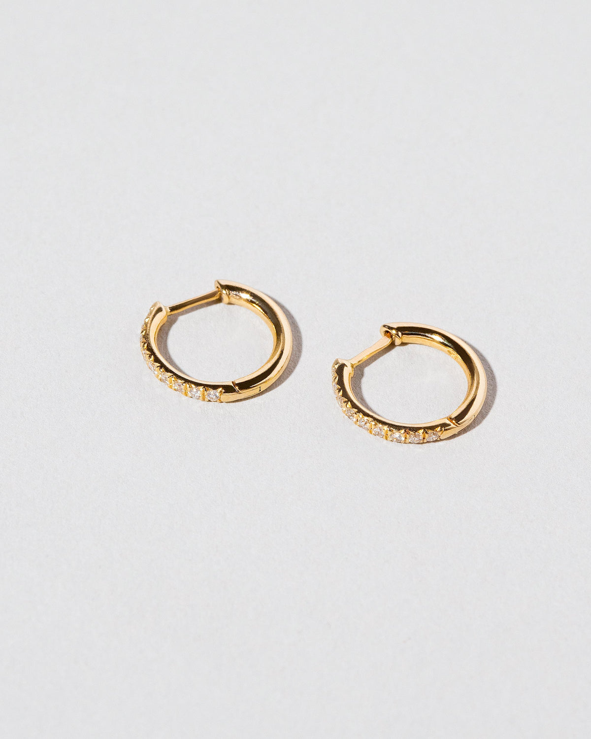 Gold Classic Diamond Snack Hoops on light color background.
