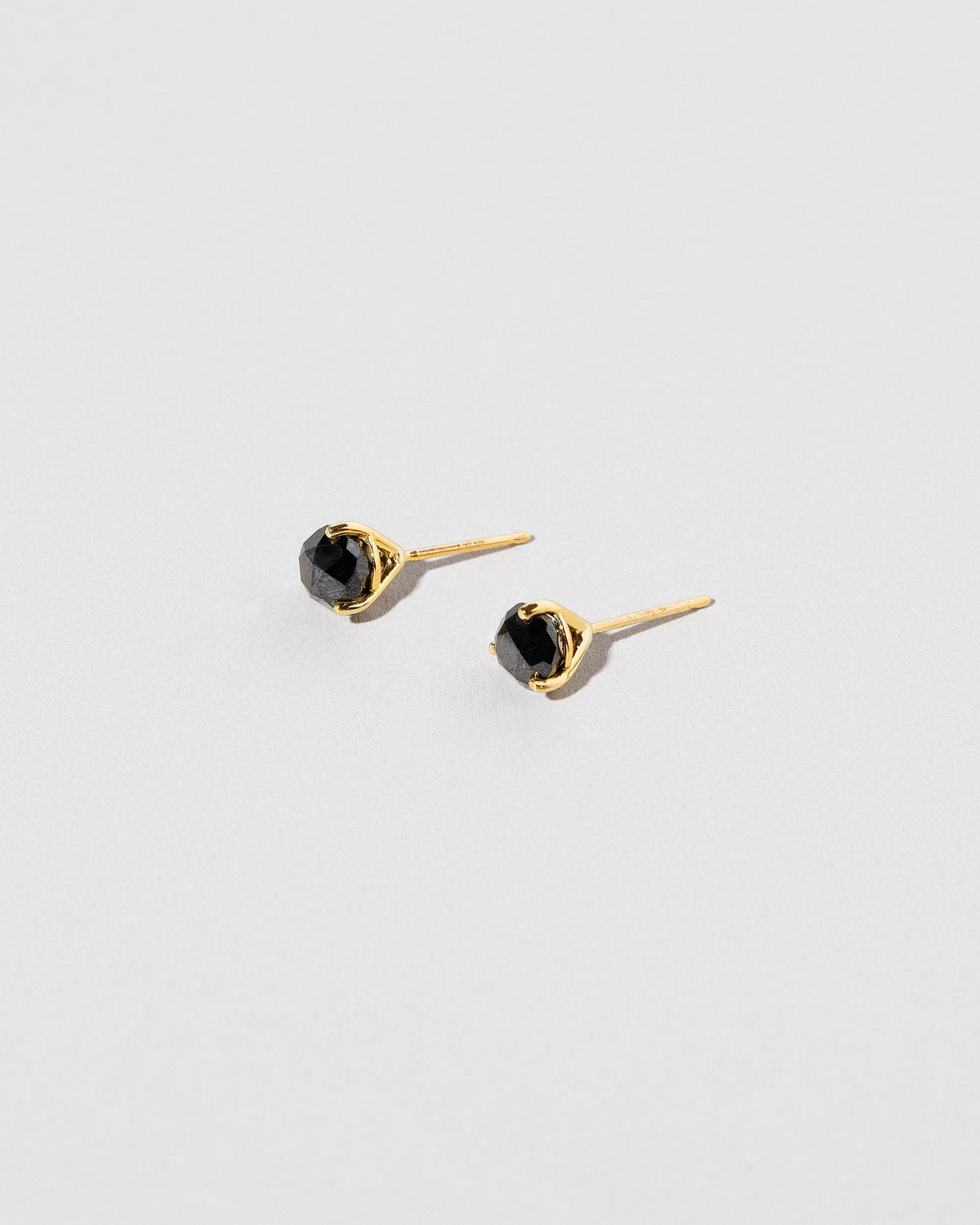  Martini Studs - Black Diamond on light color background.