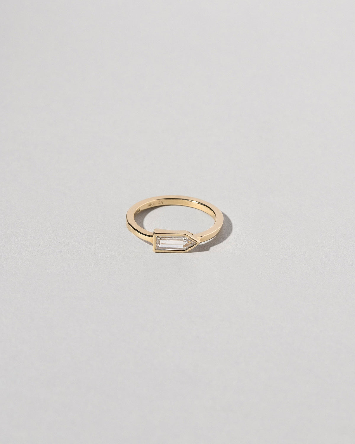 Bullet Cut Diamond Ring on light color background.