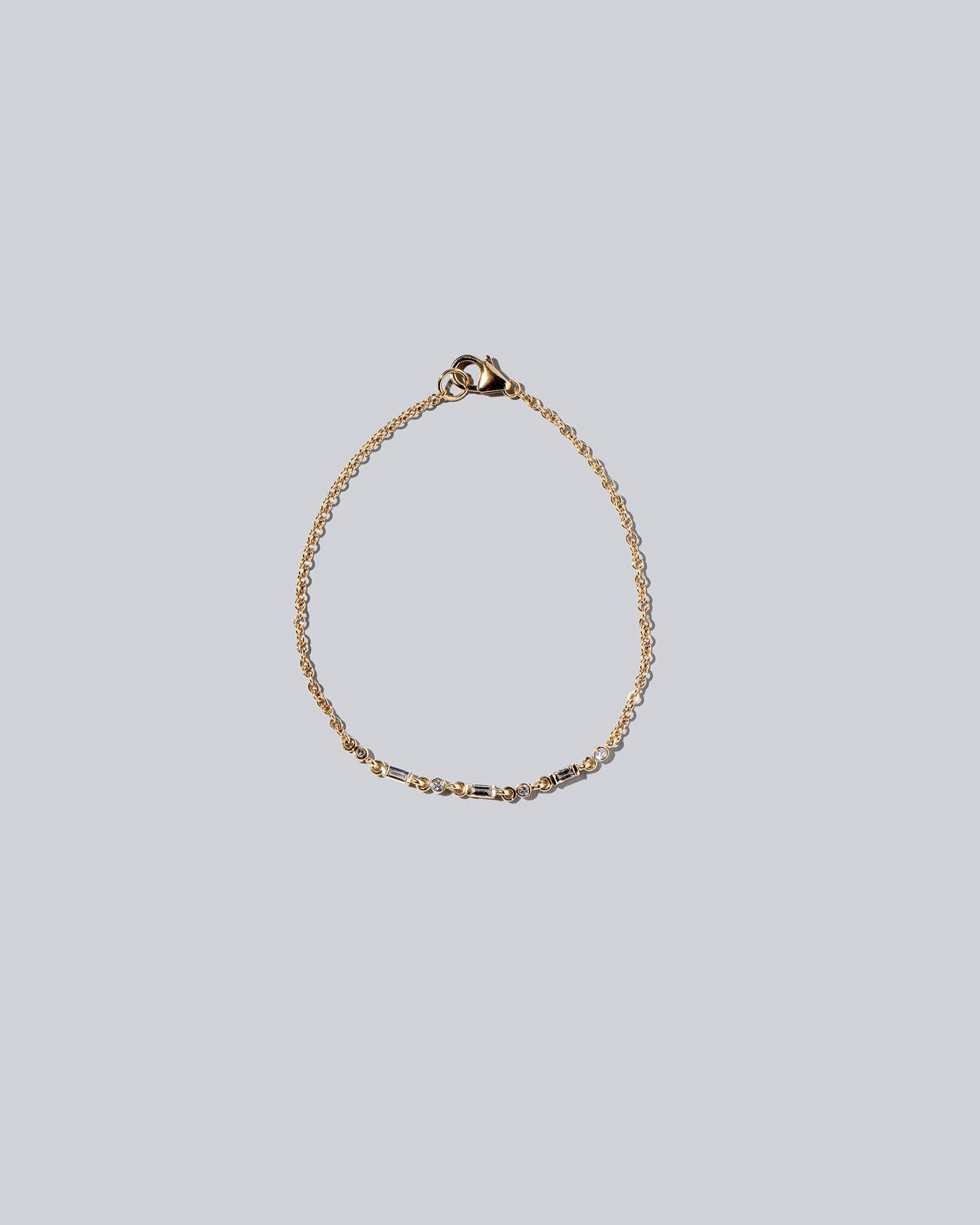 White Diamond Consecutive Building Block Bracelet on light color background.