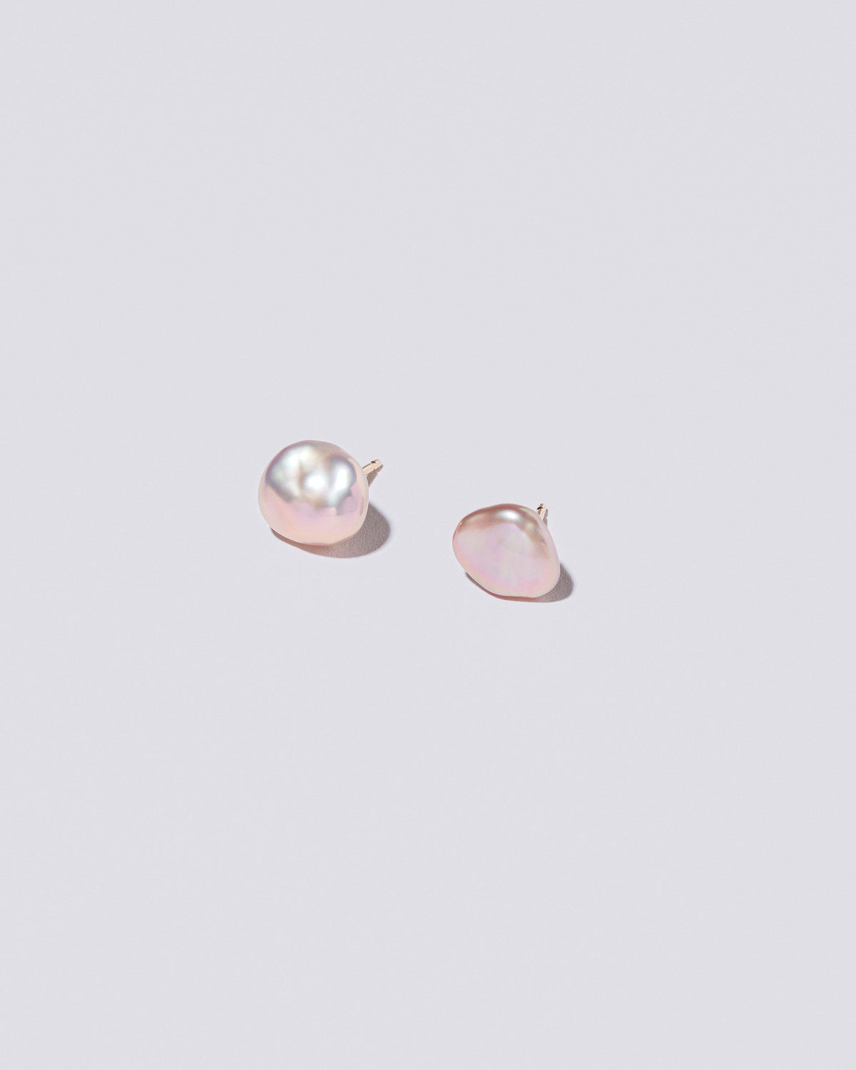  Lagniappe Pearl Stud Earrings on light color background.