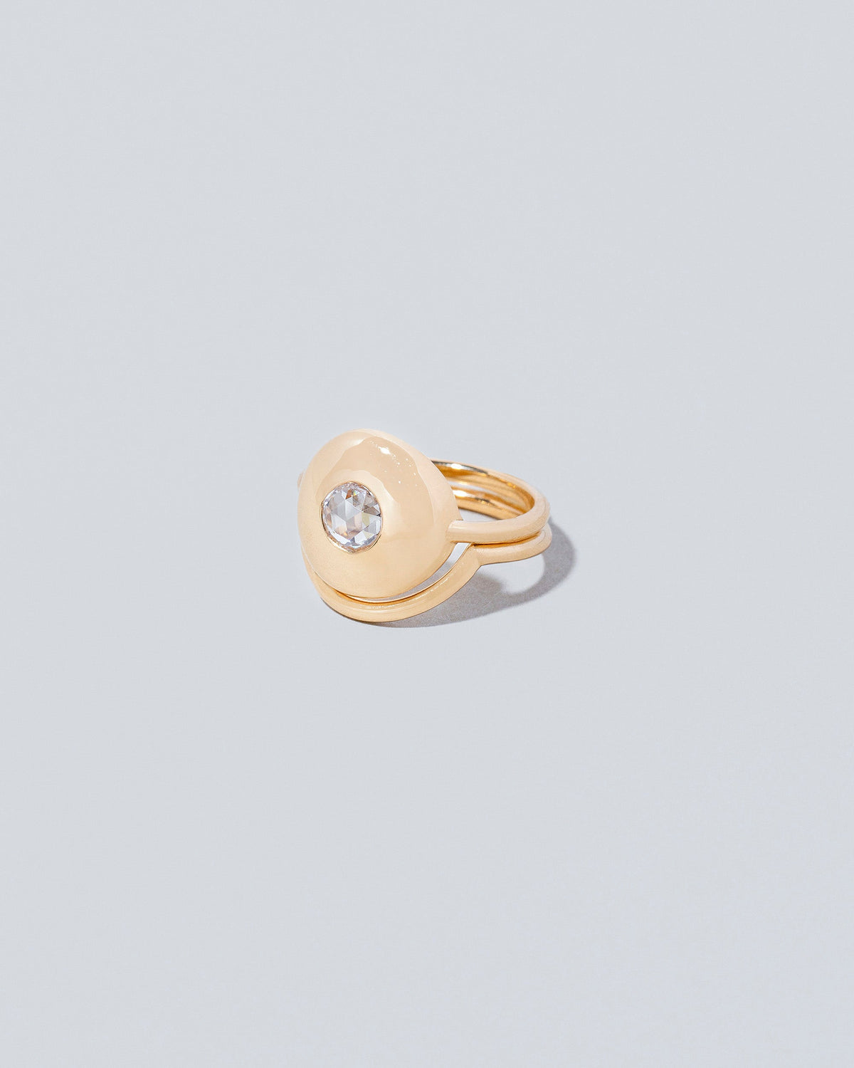 Petite Exposition Ring with Exposition Band on light colored background.