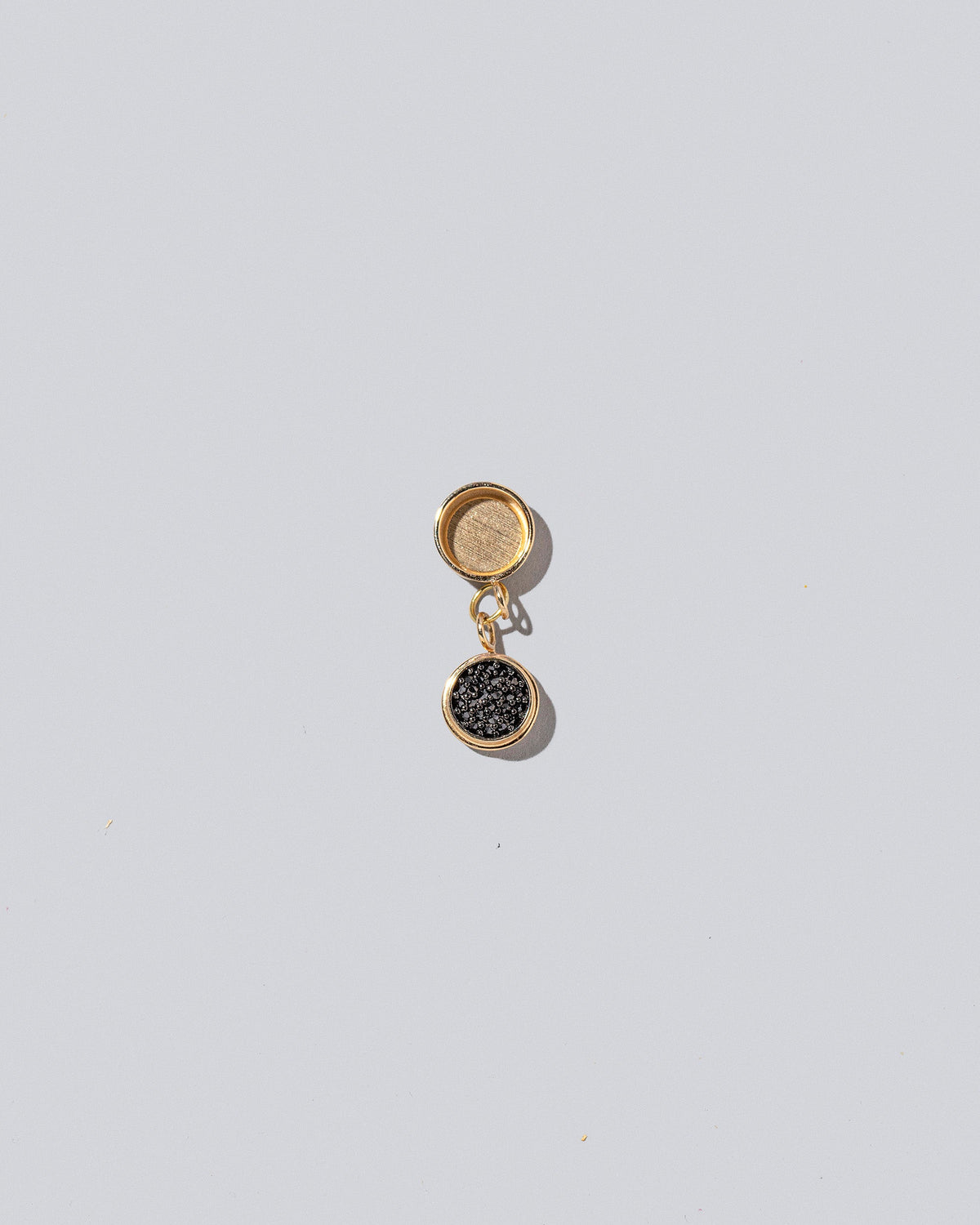Caviar Charms on light color background.