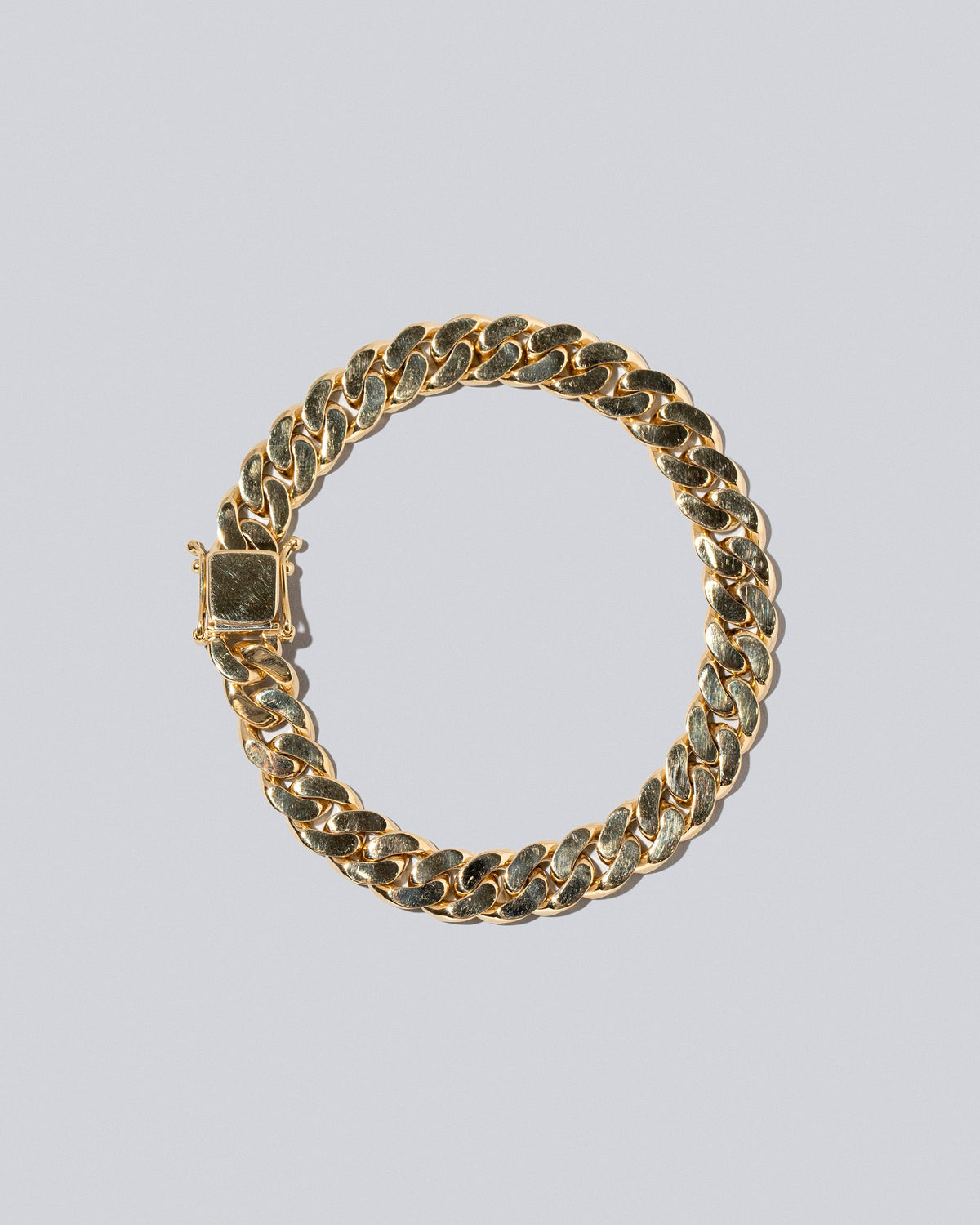 9.5mm Curb Chain Bracelet on light color background.
