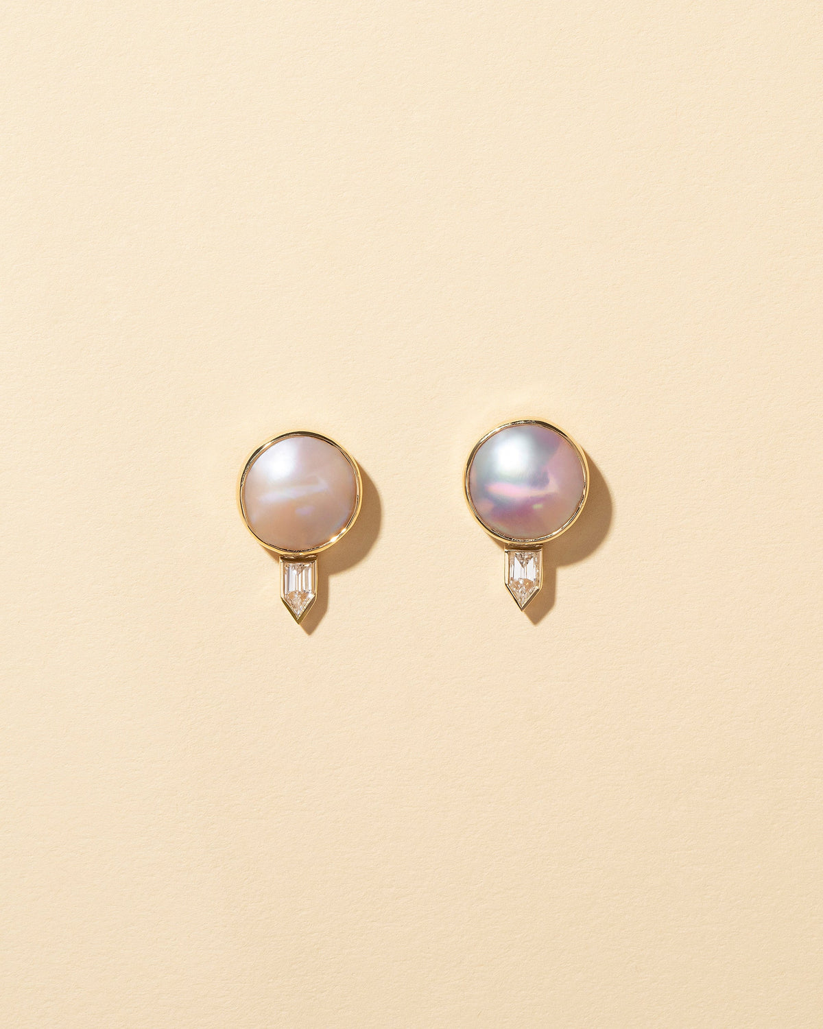  Mabe Pearl & Diamond Earrings on light color background.