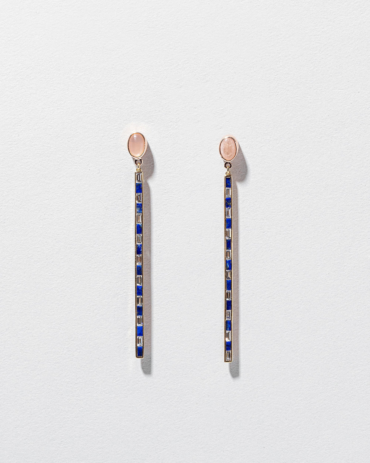  Peach Moonstone Transformation Earrings on light color background.