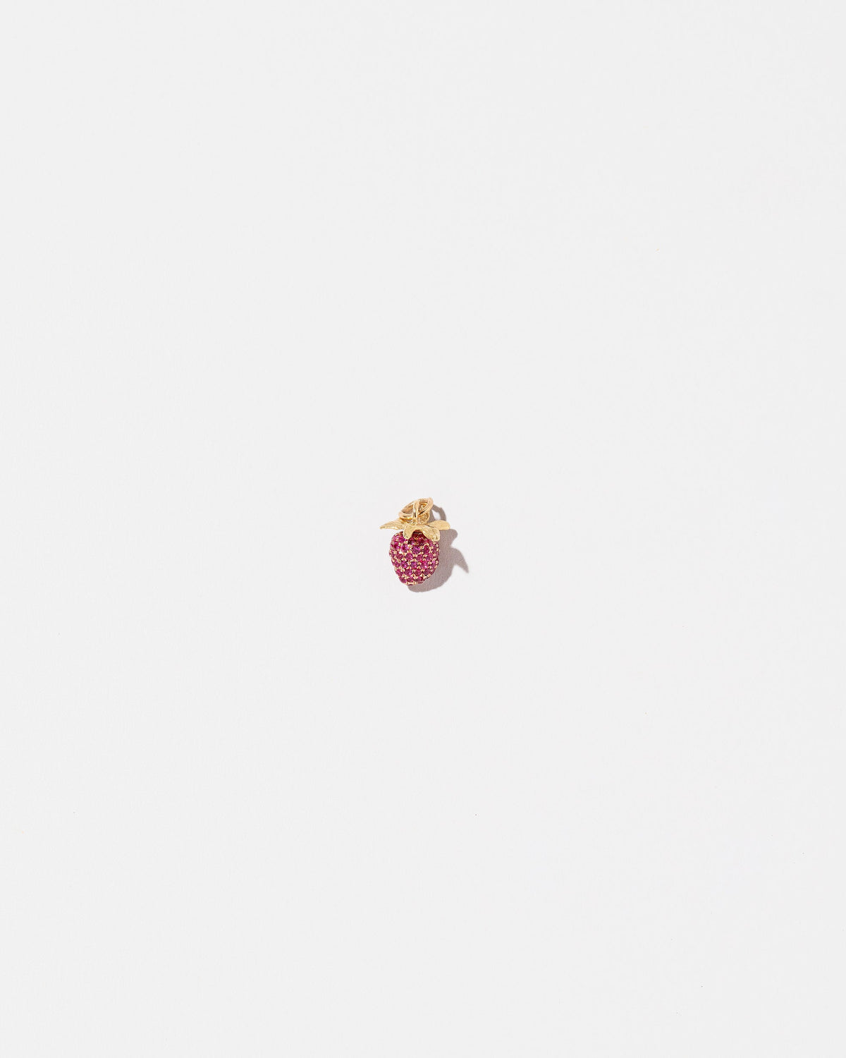 Ruby Pavé Strawberry Charm on light color background.