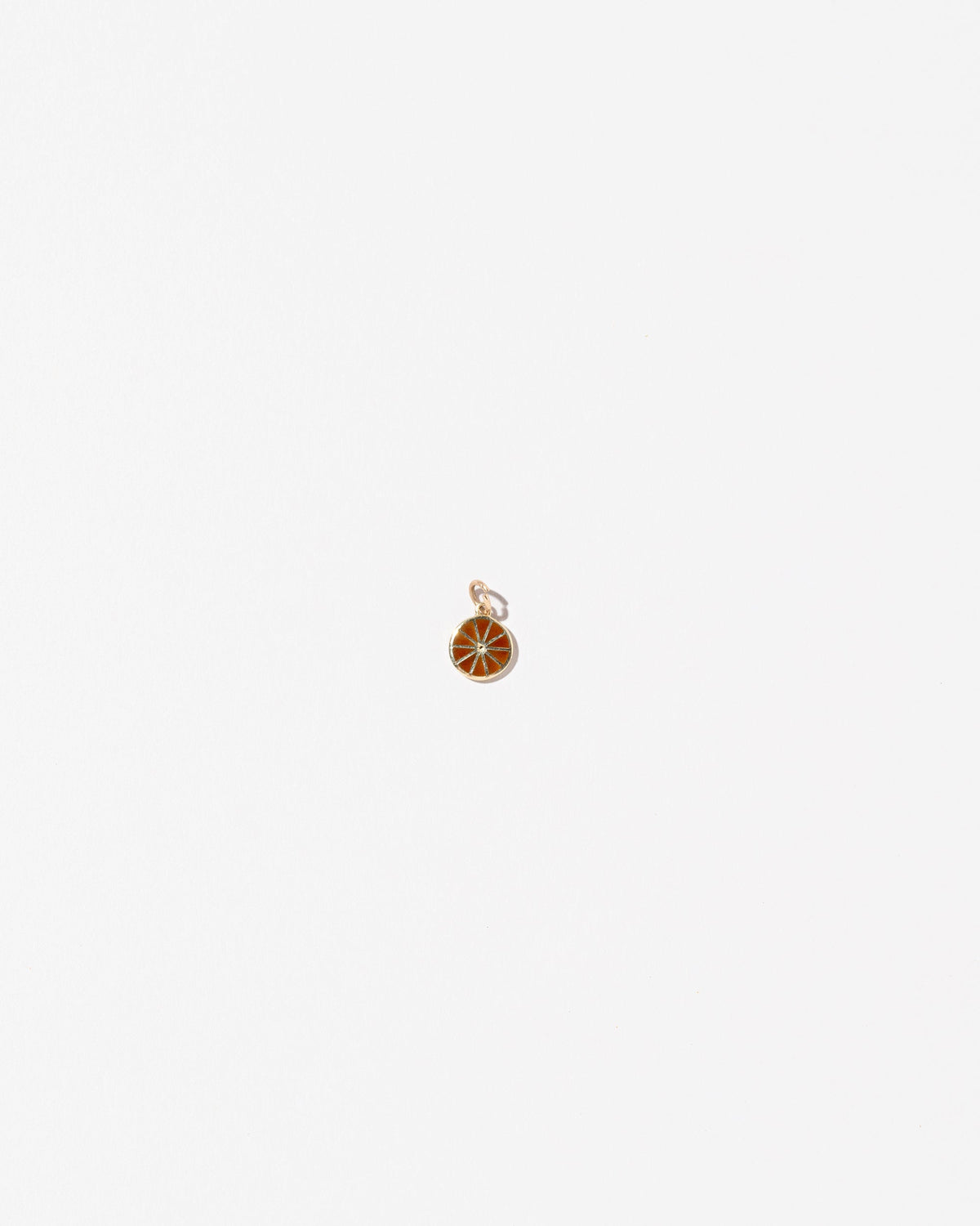 Orange Slice Charm on light color background.