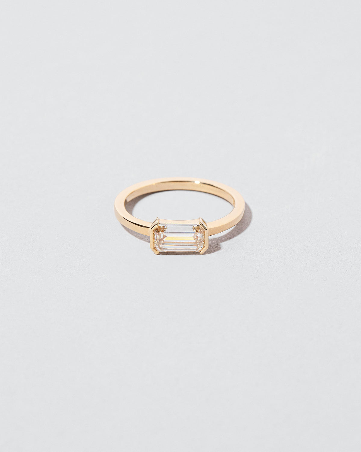 Tethys Diamond Ring on light color background.
