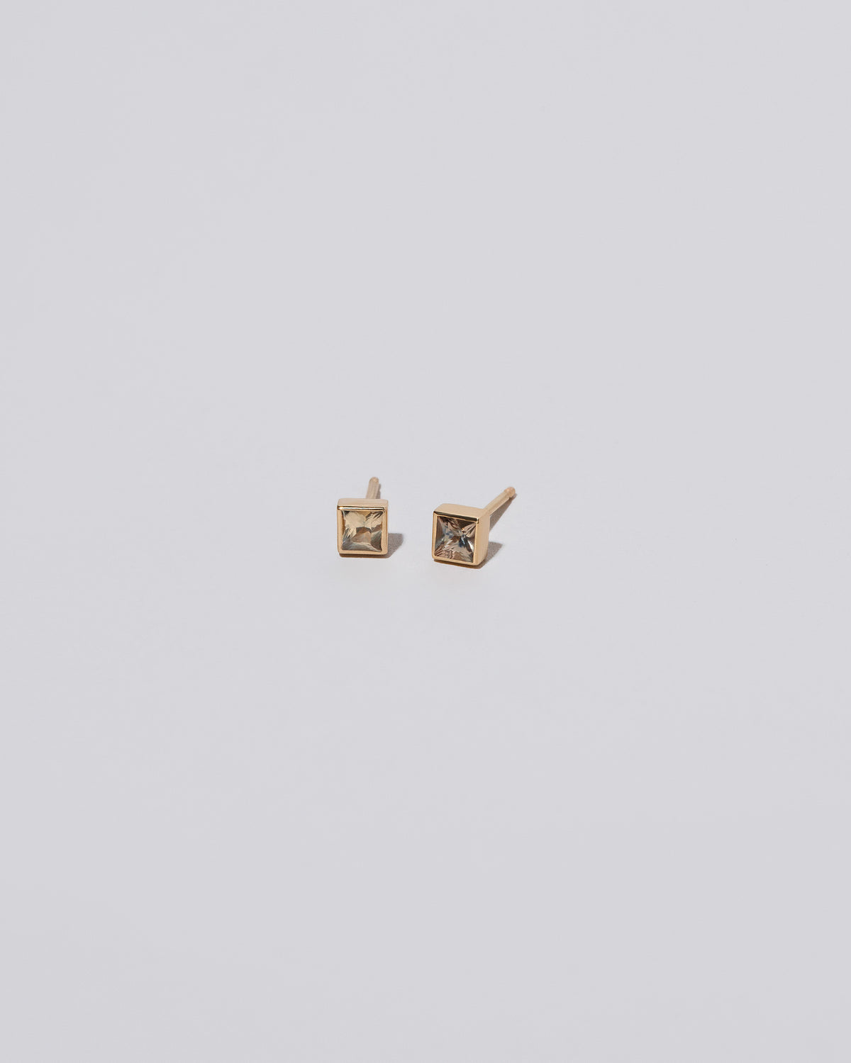 Square Stud - Yellow Sapphire on light color background.