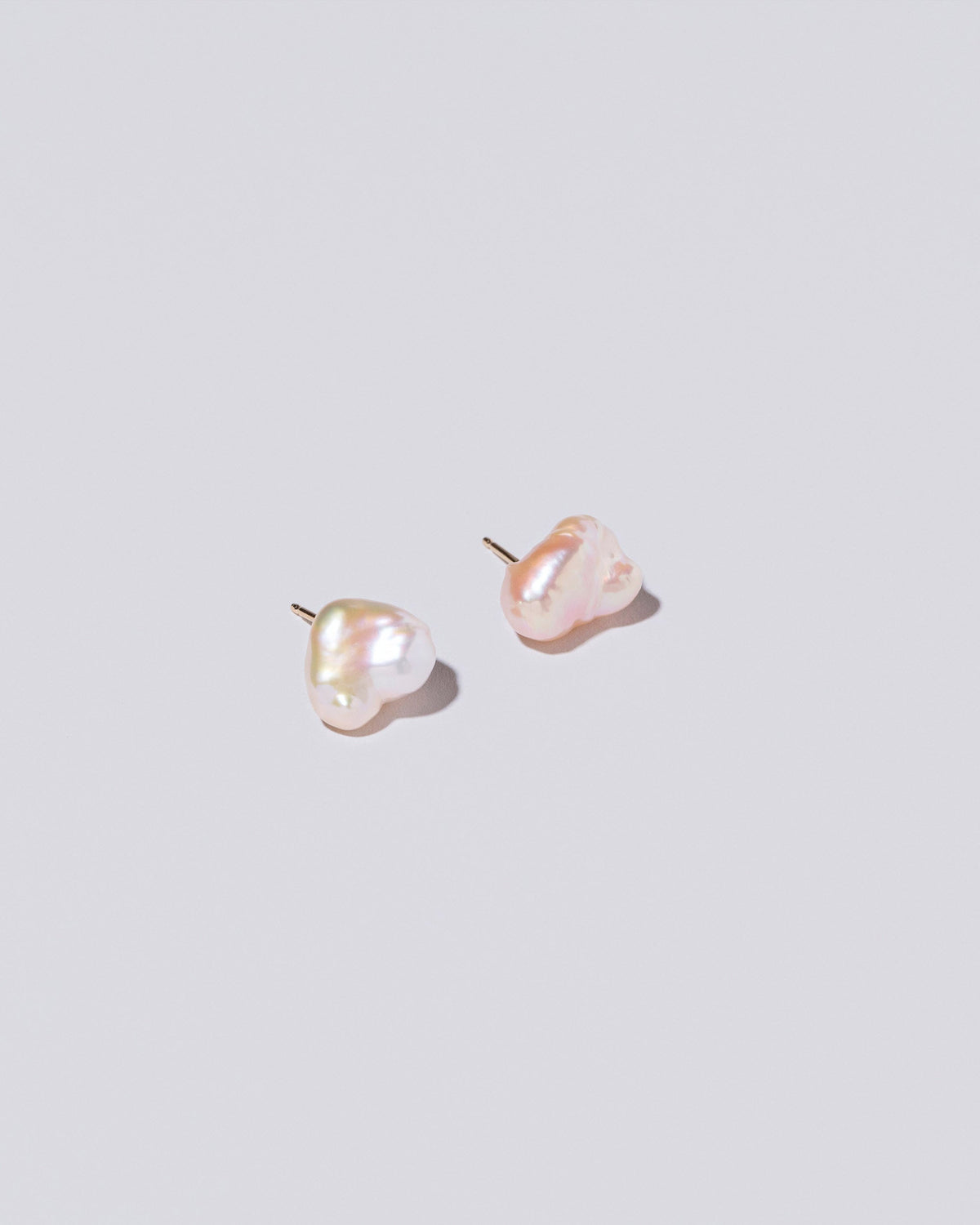  Lagniappe Pearl Stud Earrings on light color background.