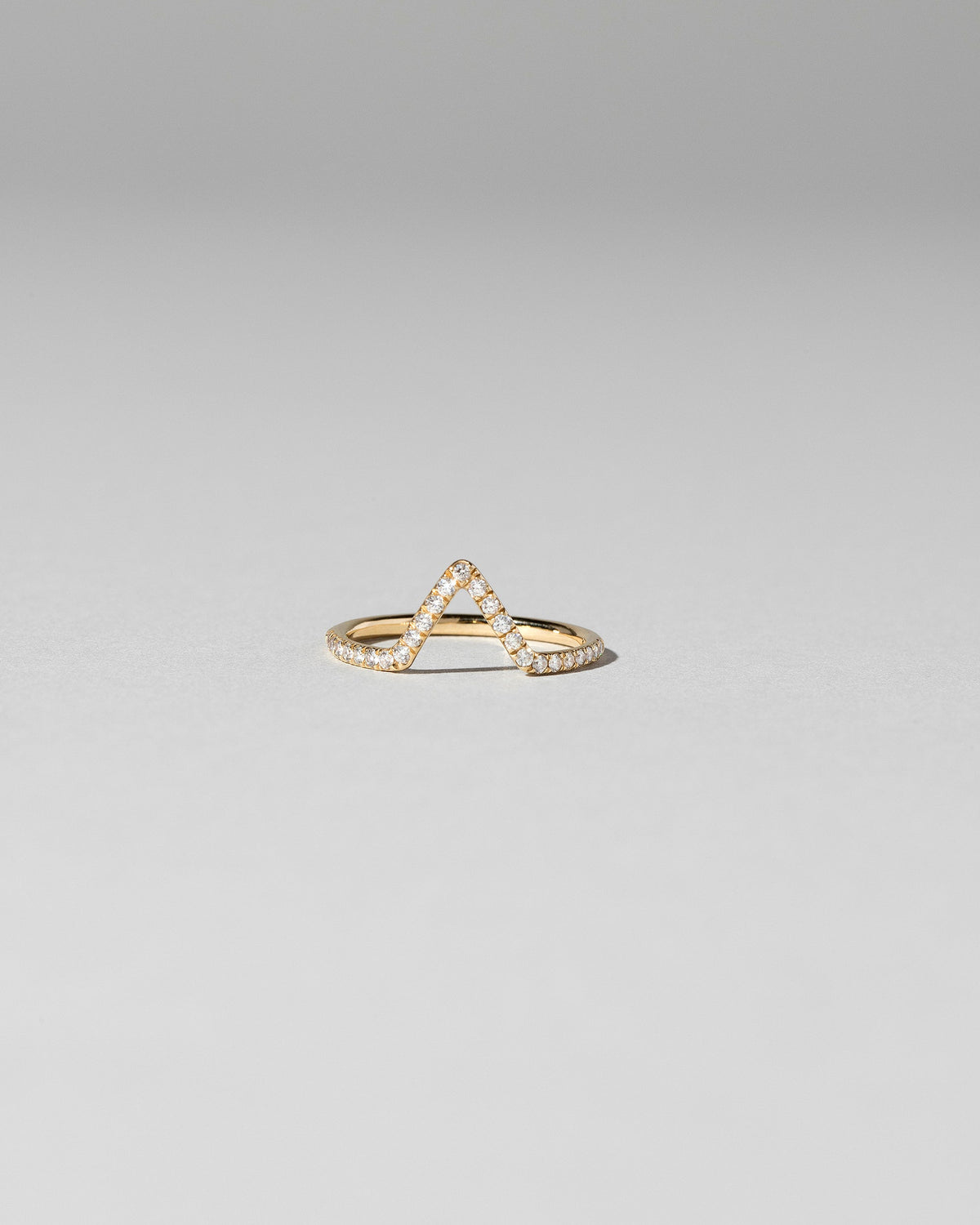 White Diamond Pavé Triangle Band on light color background.