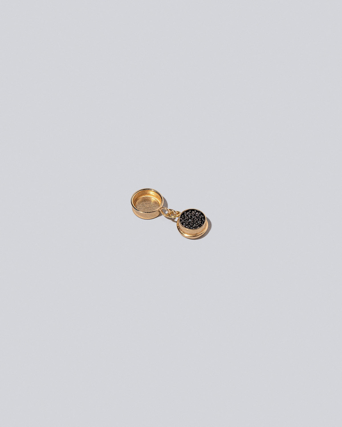 Caviar Charms on light color background.