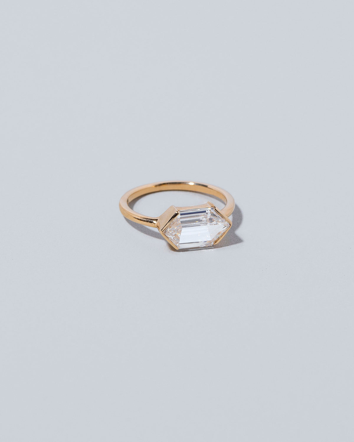 View from the side of the Headstrong Ring on light color background.